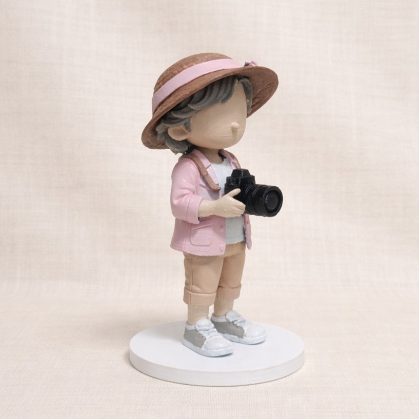 Custom wedding cake topper – photographer character with camera